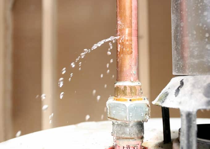 Close-up of drain pipe leaking water